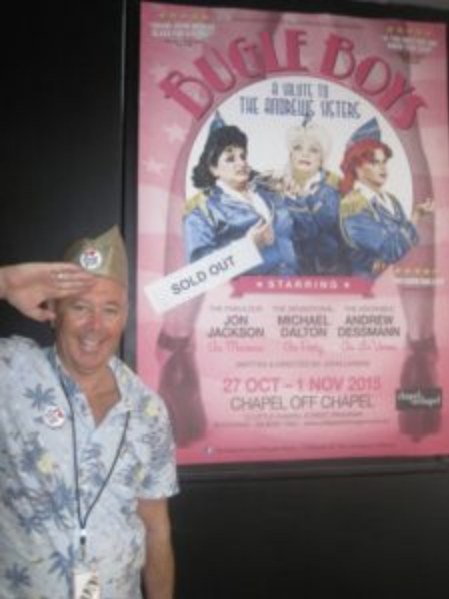 John Livings saluting beside a sold-out Bugle Boys poster at Chapel Off Chapel